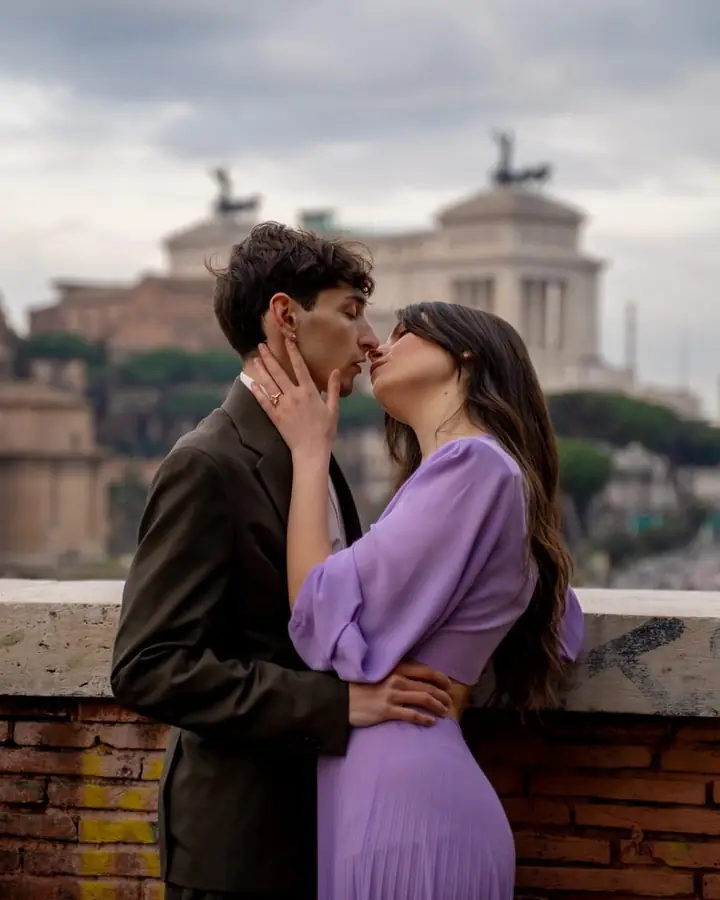 A couple on a terrace above Rome's domes, from a Perfetto Momento experience