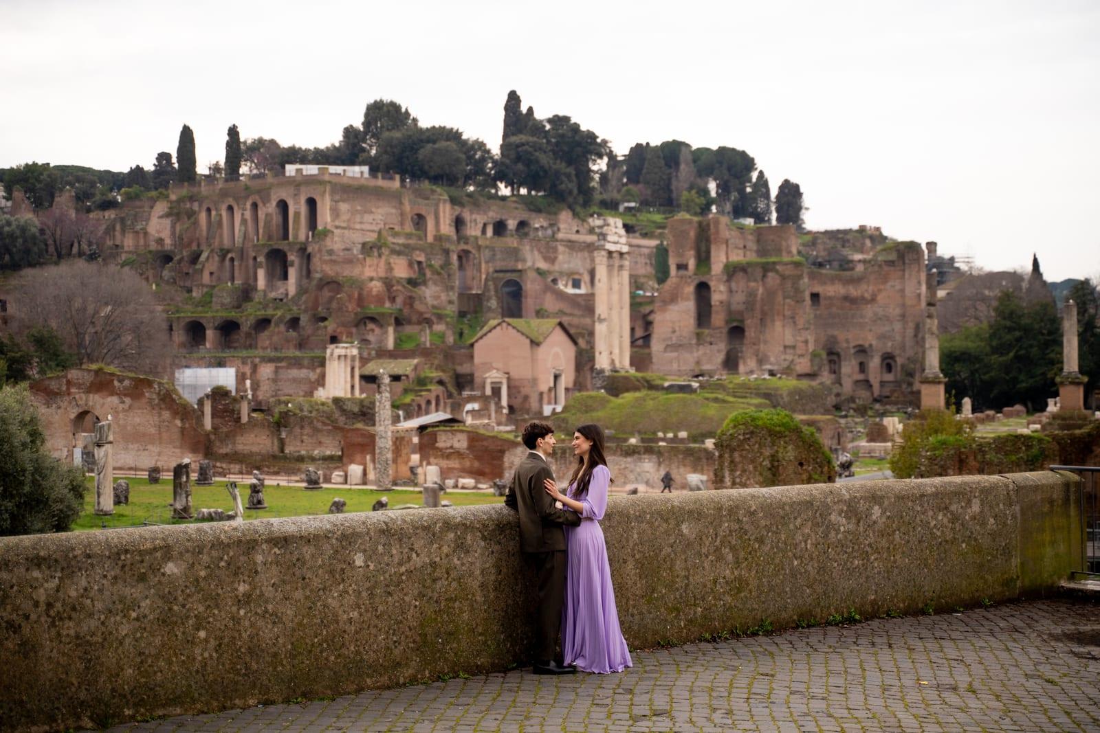 Romantic embrace against a Roman backdrop